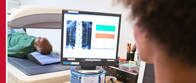 A researcher looking at a computer screen