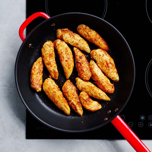 Cooking chicken in a pan