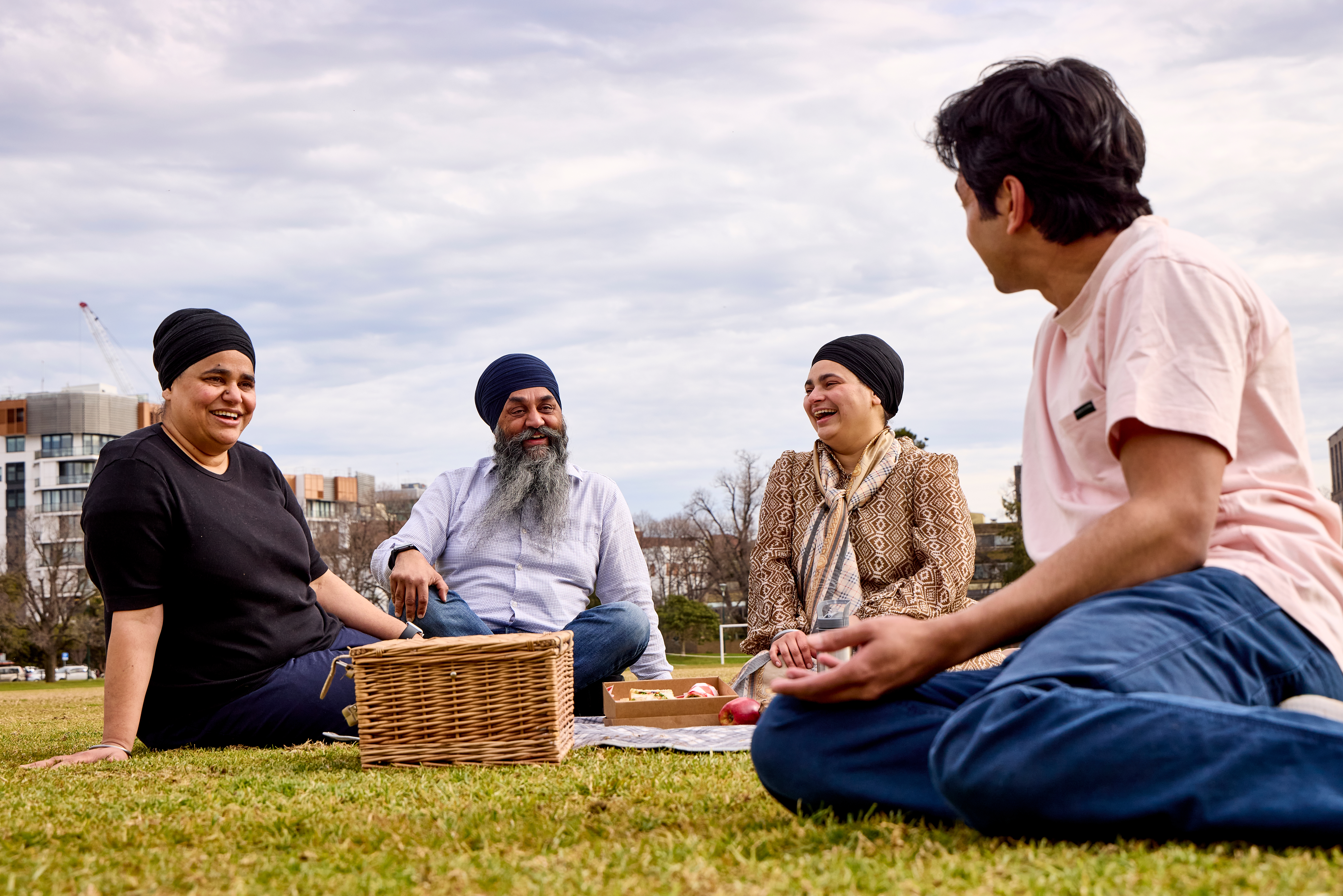 A Punjabi family sitting in a park