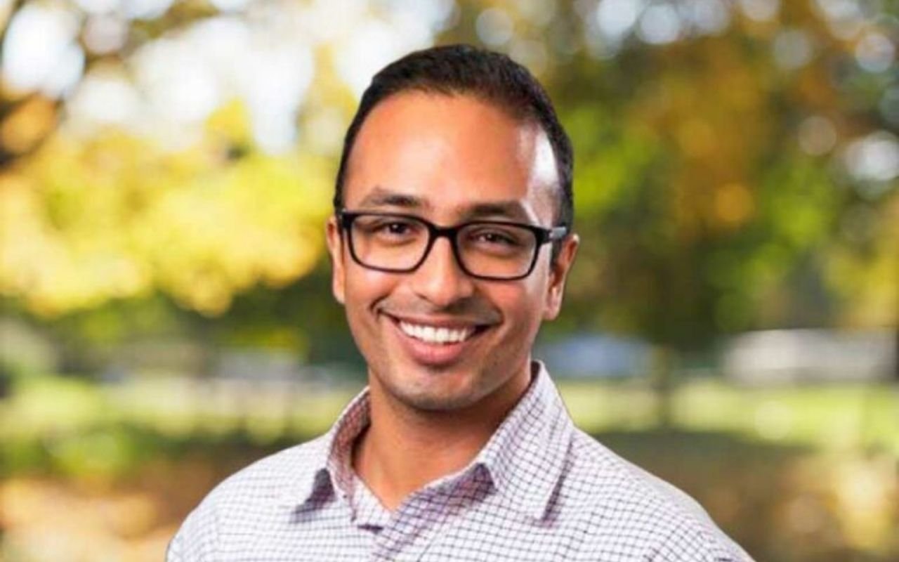 Heart Researcher Associate Professor Nitesh Nerlekar standing outside in nature smiling 