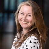 Maree Hackett wearing a white shirt and a black and white patterned shirt.