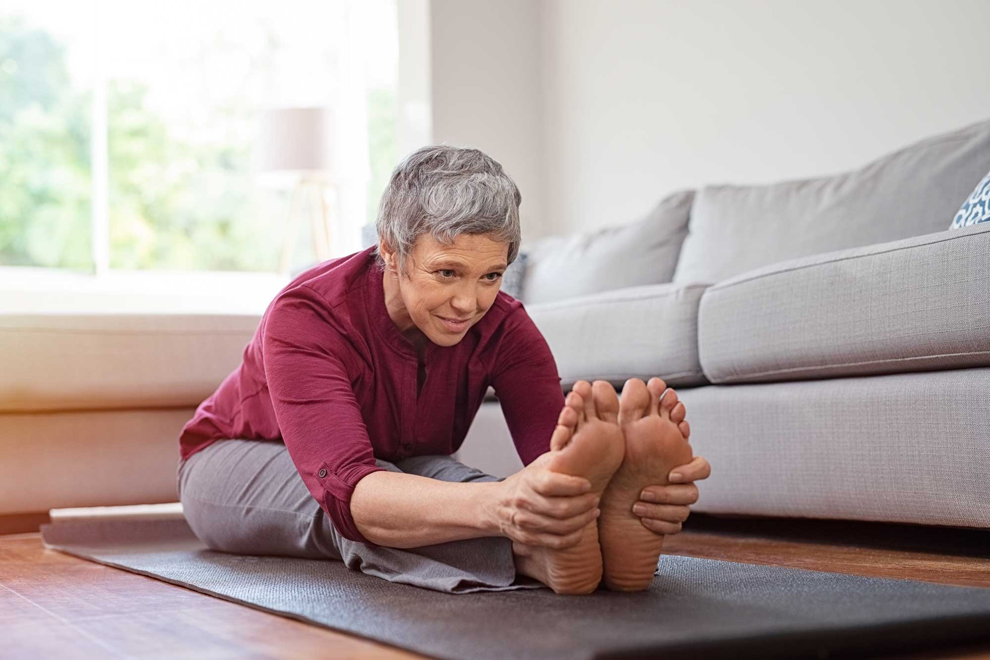 Older woman yoga stretch