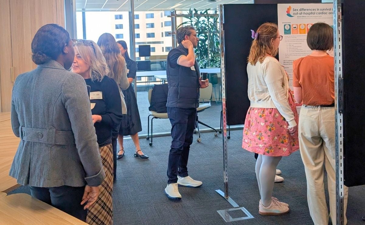 Attendees standing looking at the awarded project displays