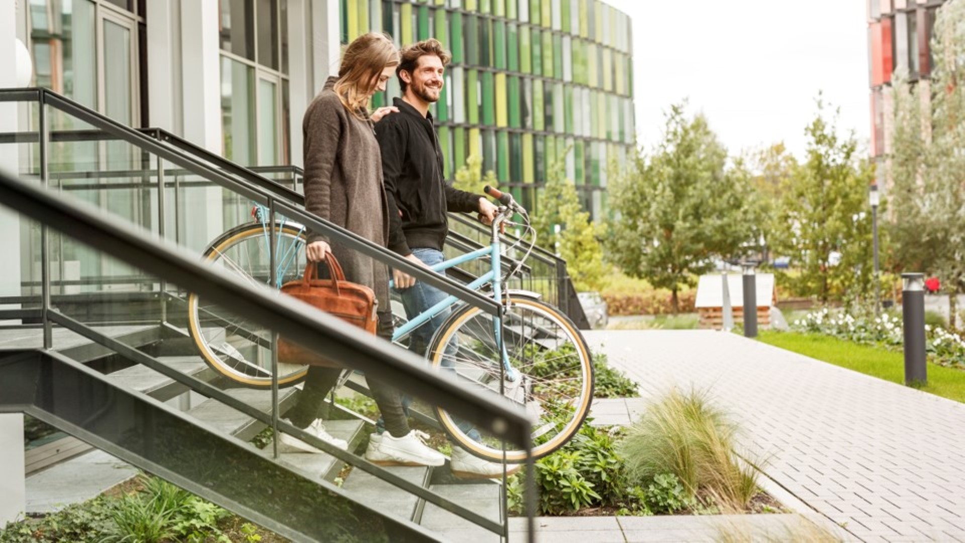 A couple going out with a bike
