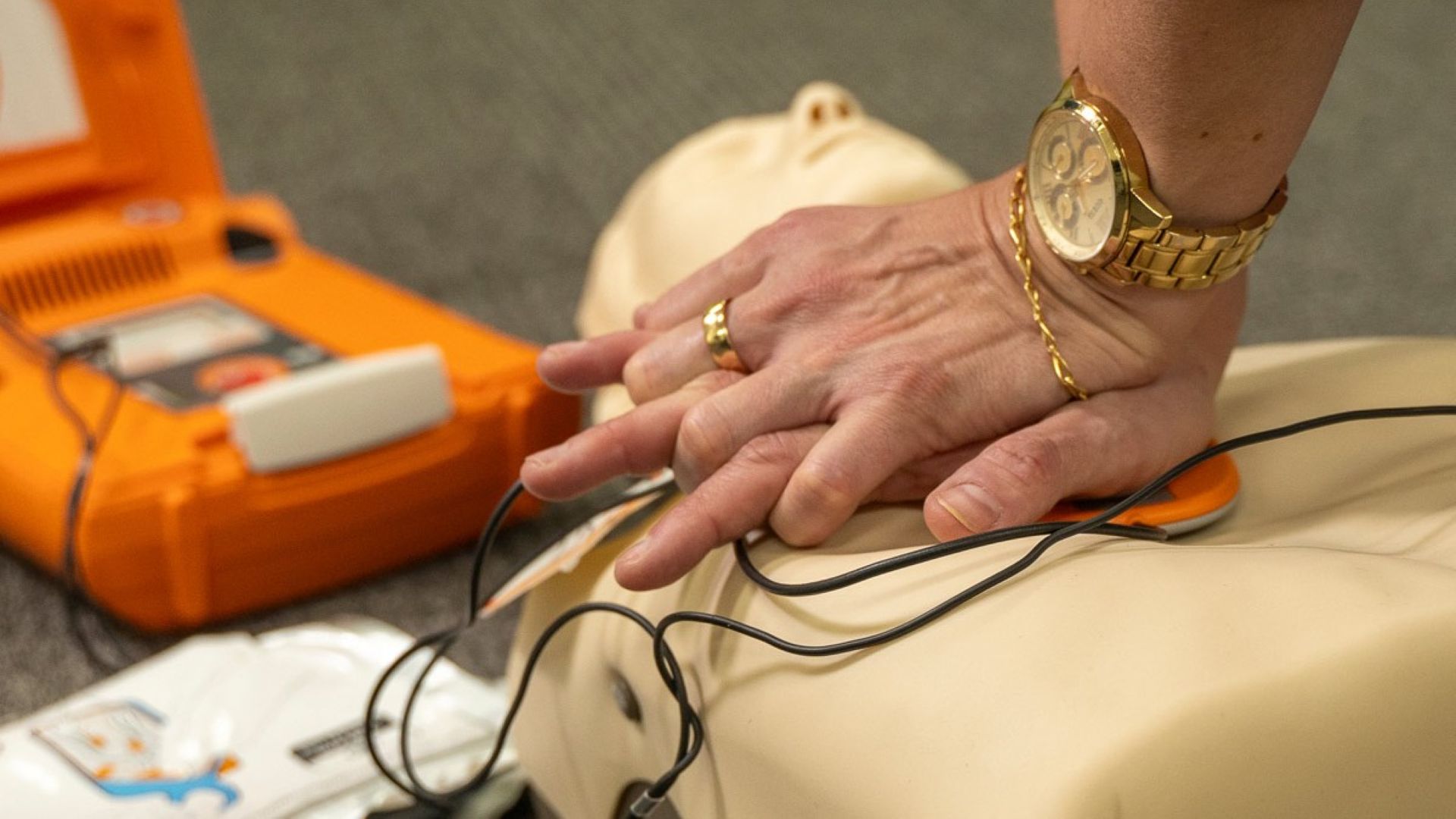 A person doing CPR on a dummy 