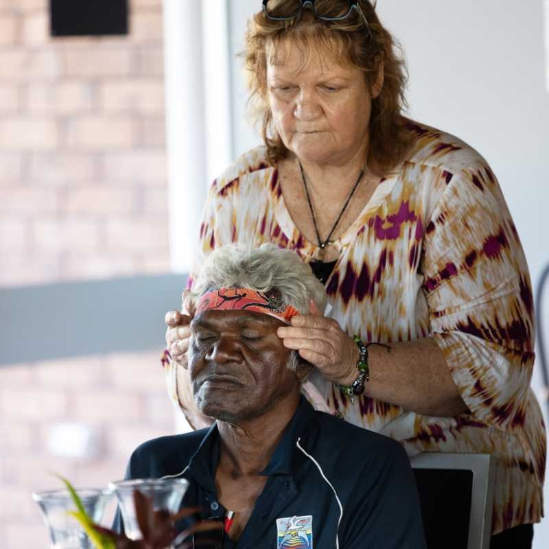 A First Nations man receiving a head massage at a Champions4Change workshop