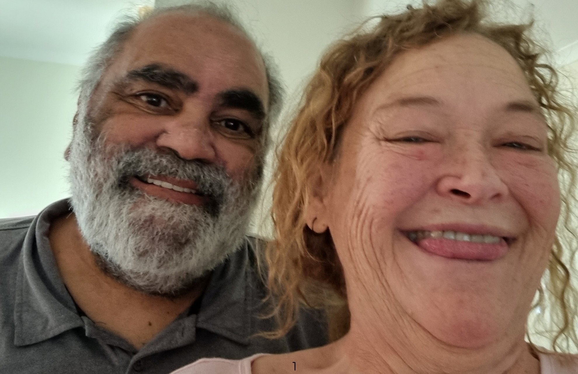 A picture of Martha smiling next to her partner