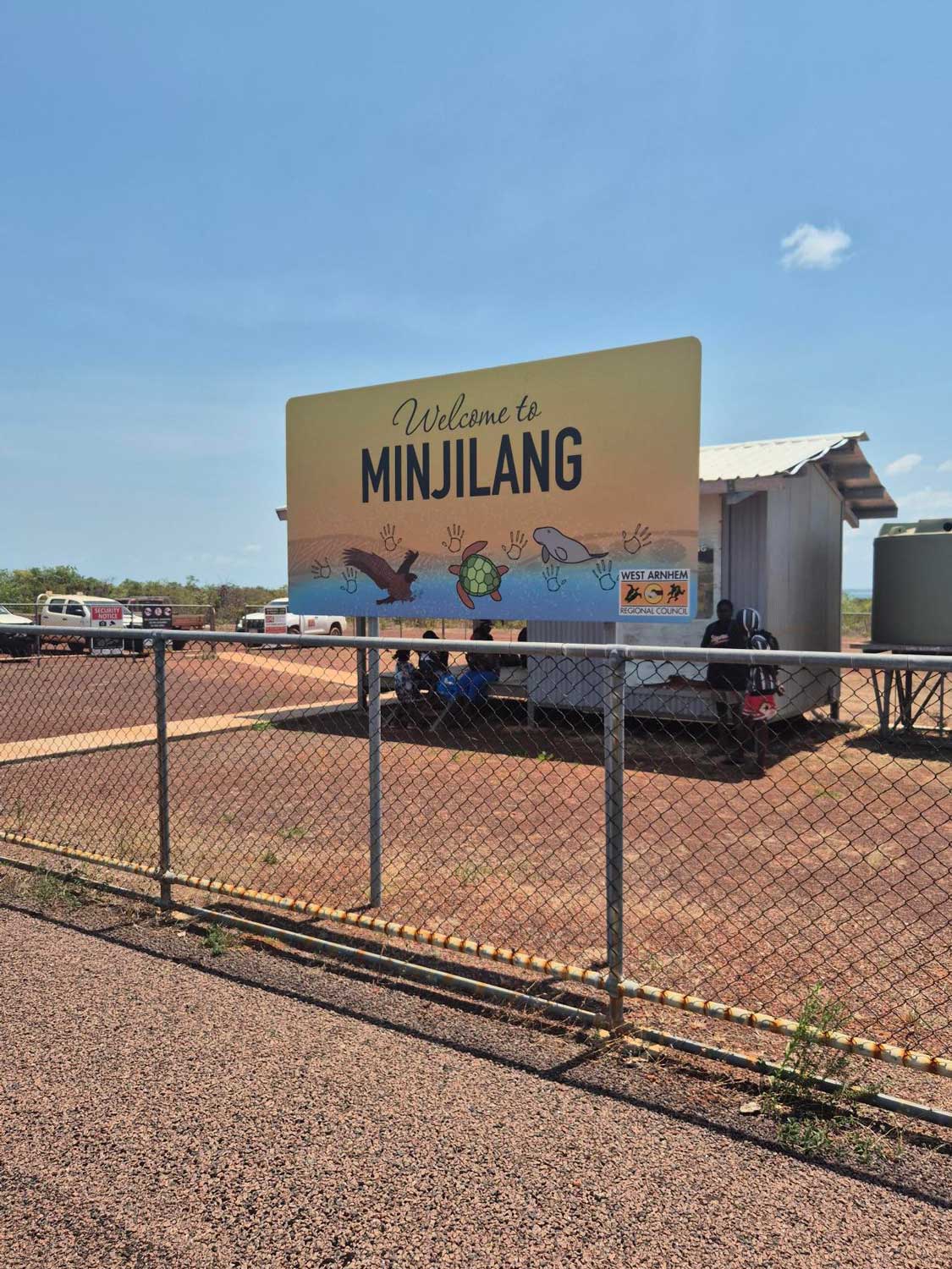 Outback sign with 'Welcome to Minjilang'