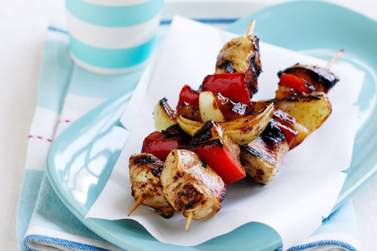 Grilled chicken kebabs with colorful peppers and juicy tomatoes
