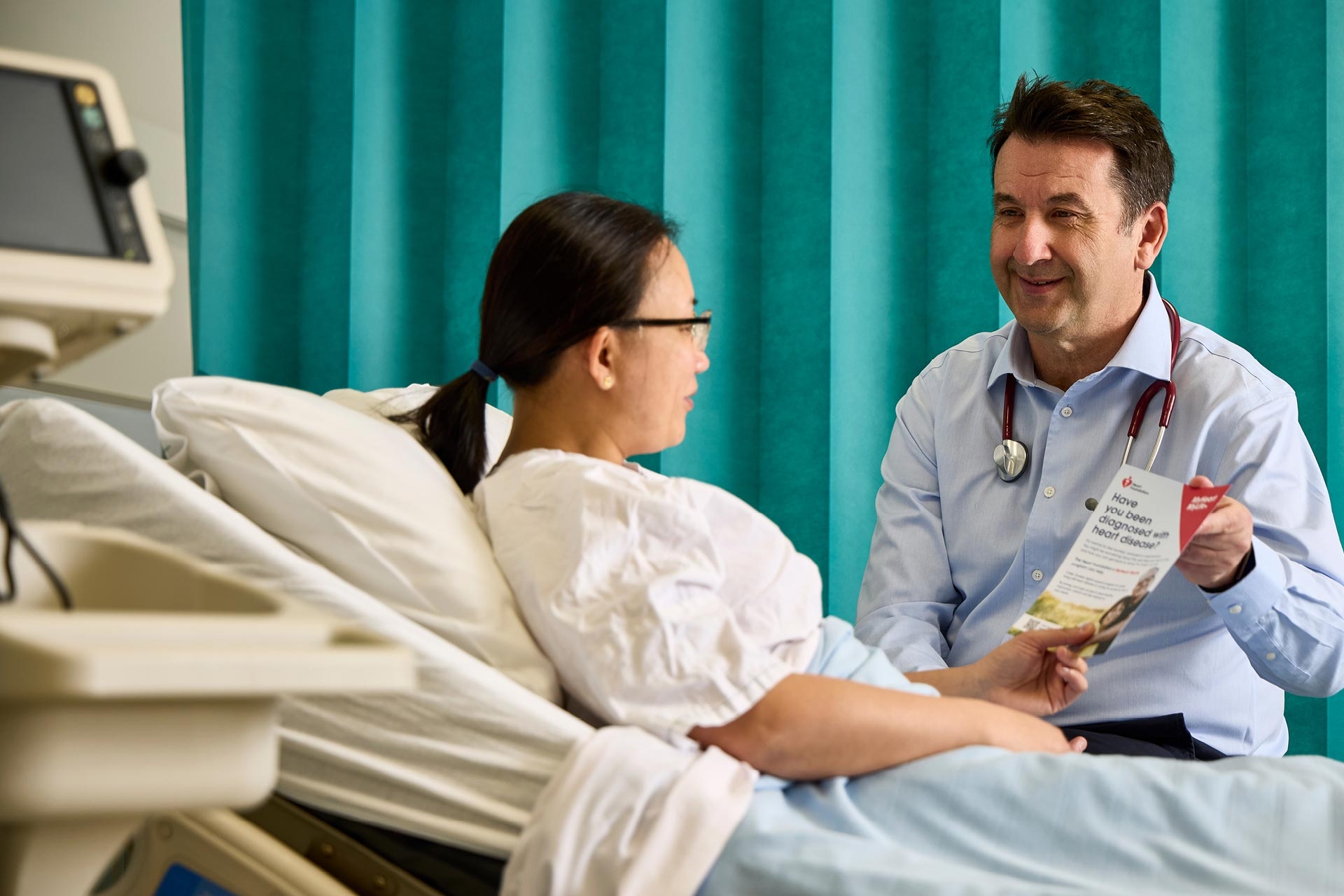 A doctor talking with a patient about MyHeart MyLife
