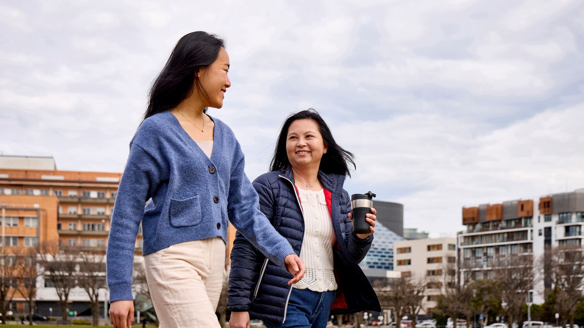 Two Vietnamese walking in the park