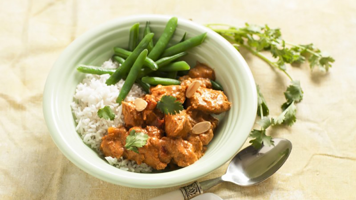 Butter-less chicken served with rice and green beans
