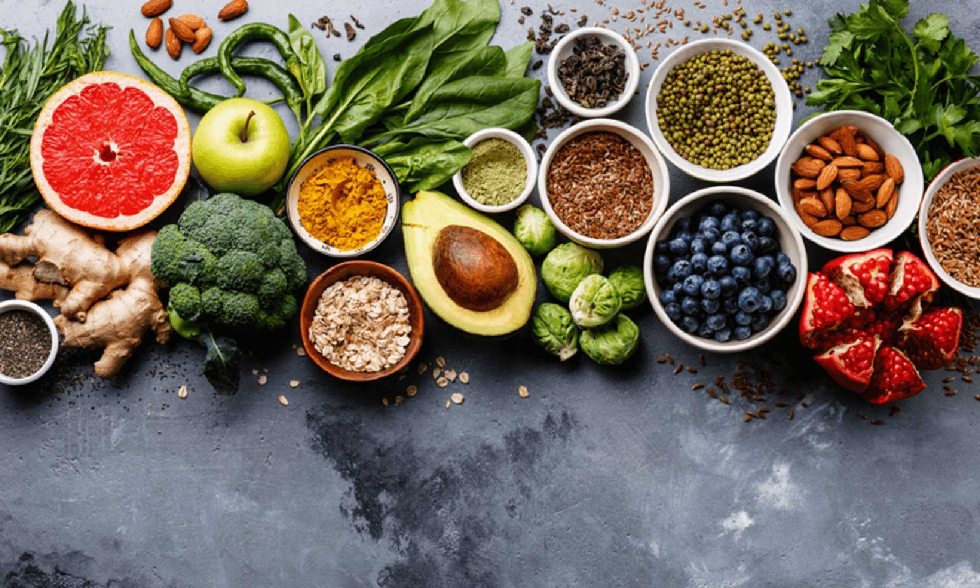 A healthy spread of fruits and veggies in bowls, ready to be enjoyed.