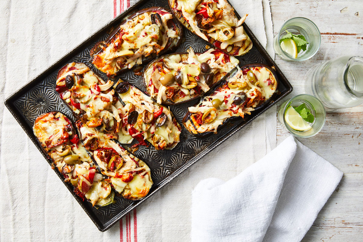  A neatly arranged tray of pizza on a table, accompanied by a napkin