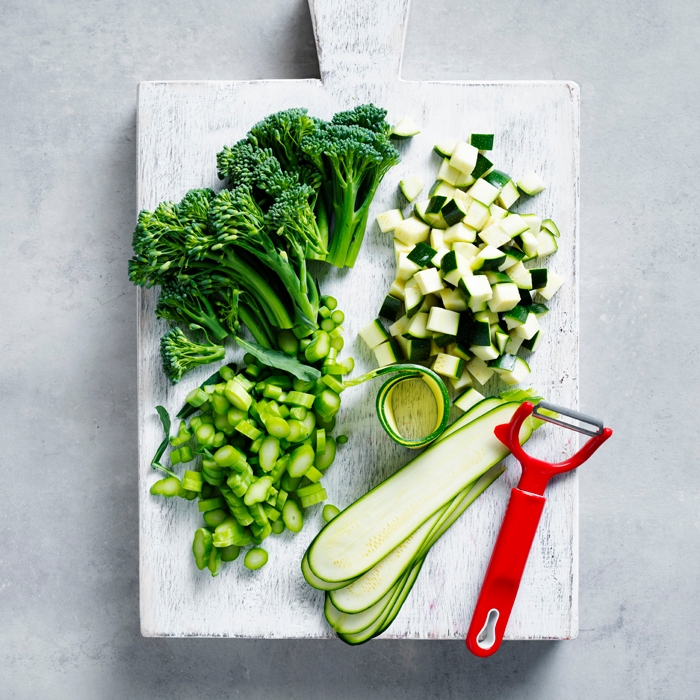Green vegetables on a chopping board