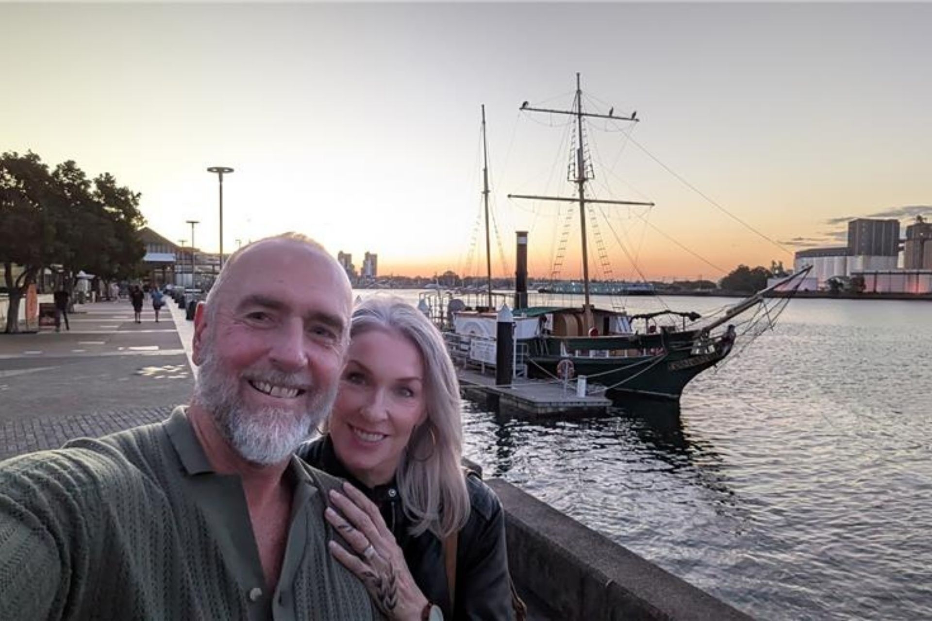 Phil Moore and his wife by the beachside