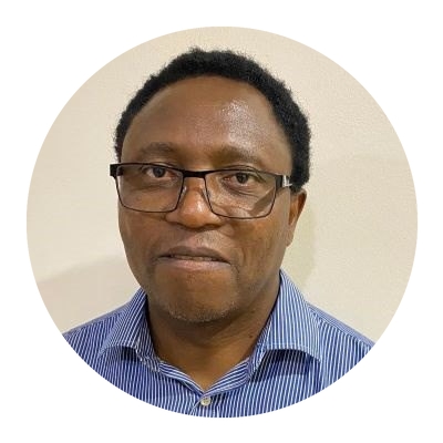 A man wearing glasses and a blue shirt.