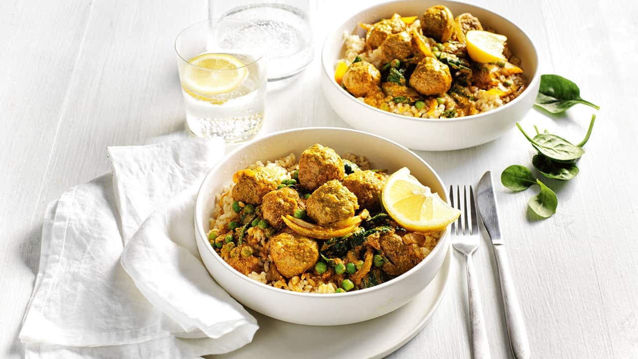 Two bowls of delicious Tikka meatball curry