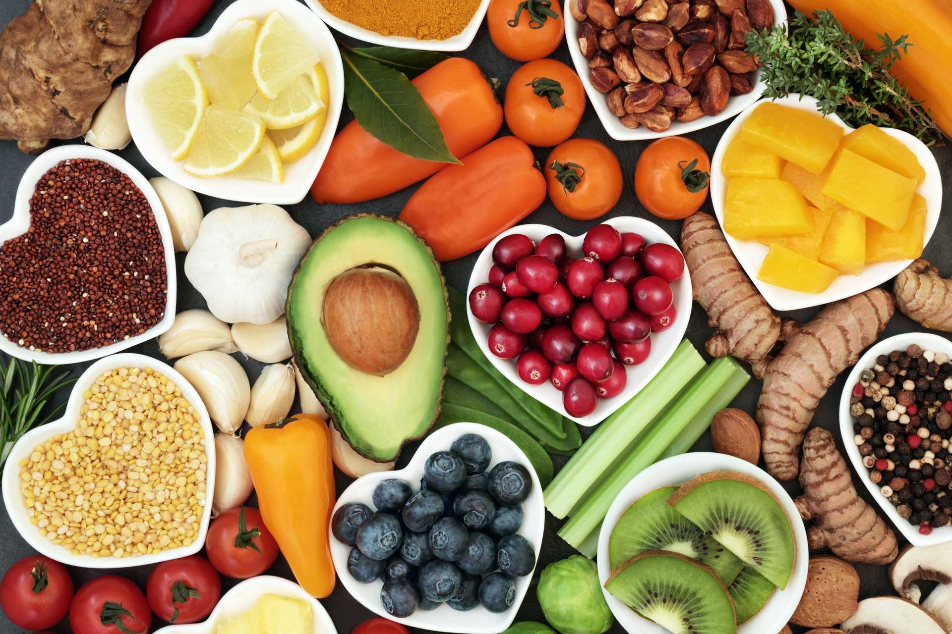 Vibrant mix of fruits and veggies in bowls.