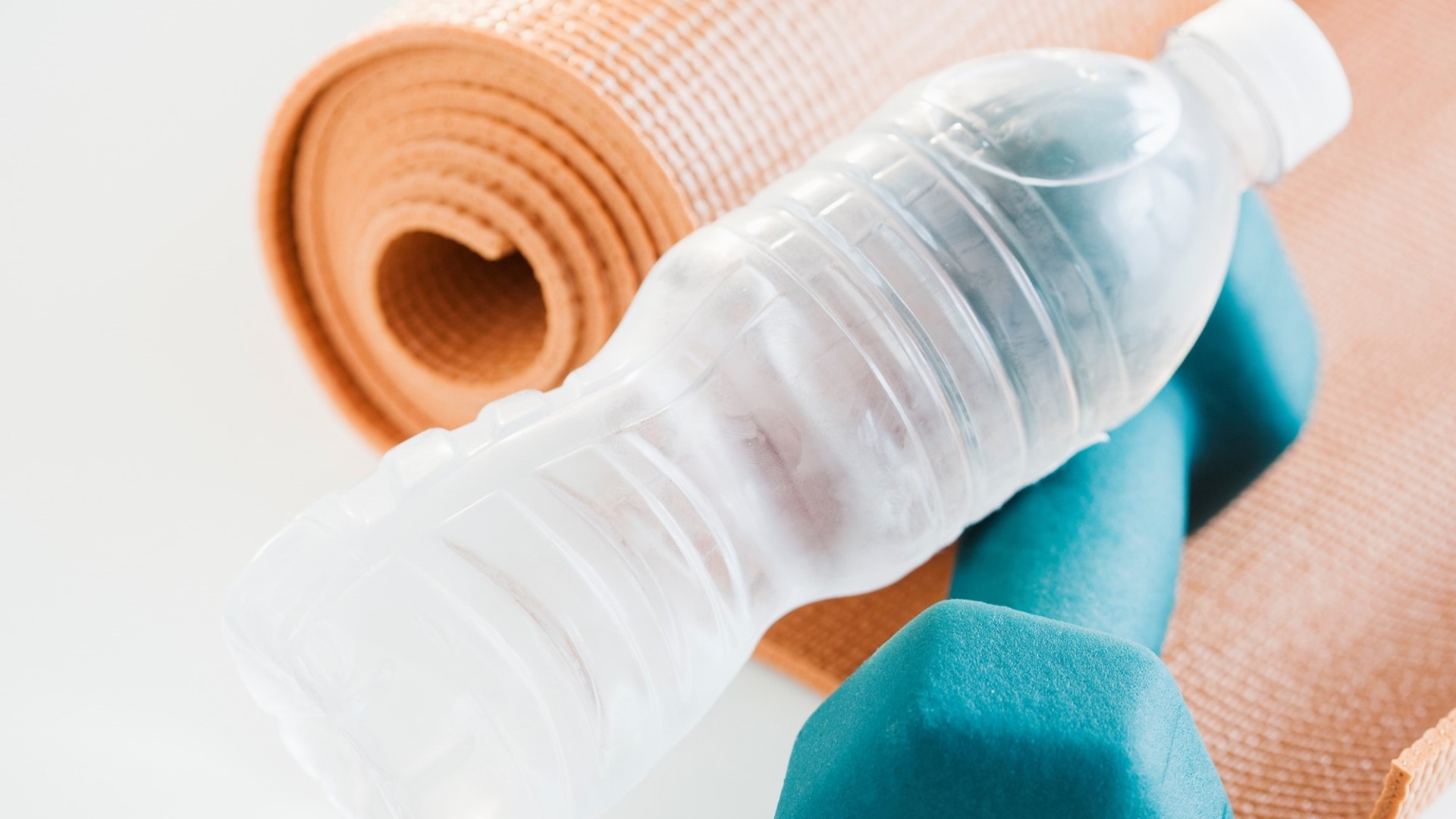 exercise floor mat with water bottle and dumble