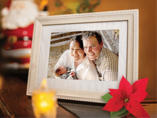 Photo frame of Shane and Tara set in festive background