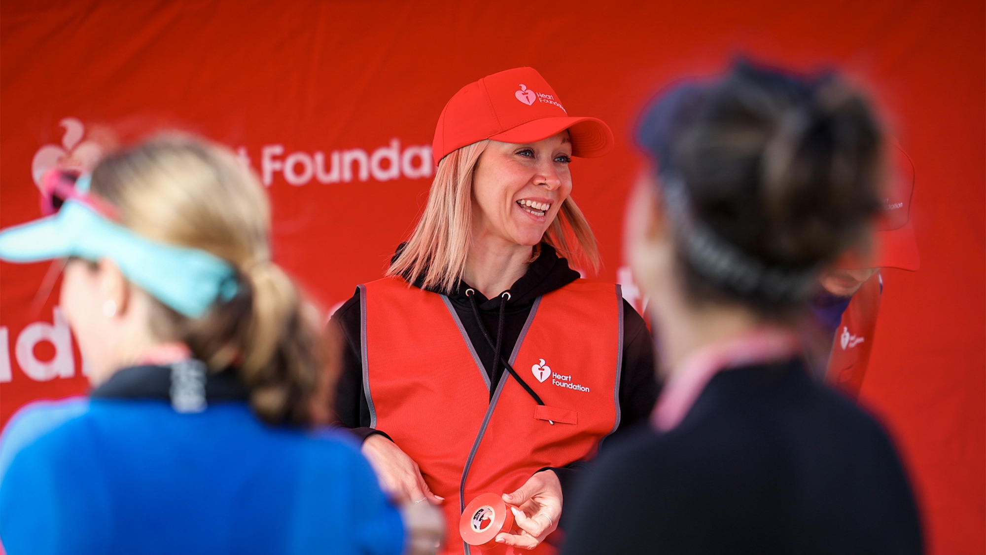 Heart Foundation team member smiling while at a volunteer event.