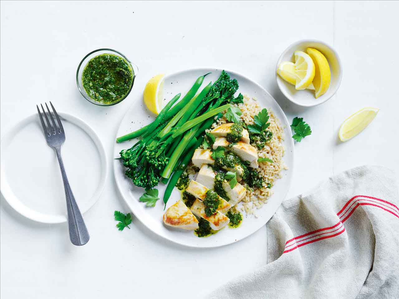 A plate of food featuring a savory combination of chicken, rice, and broccoli