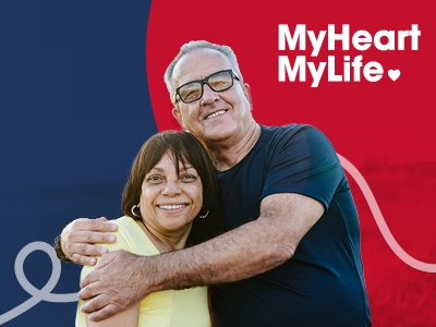 A man and woman embracing and smiling, with a MyHeart MyLife logo alongside them.