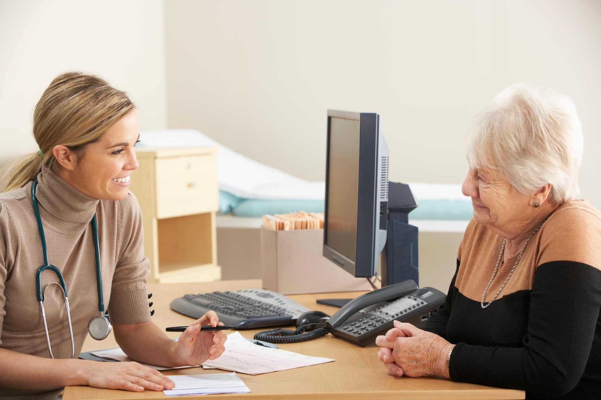 Senior woman visiting her female healthcare professional