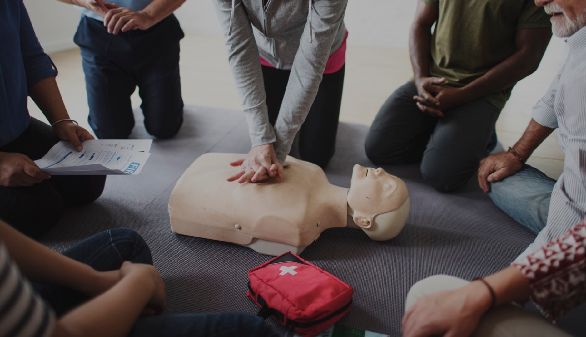 CPR being practiced on a dummy human
