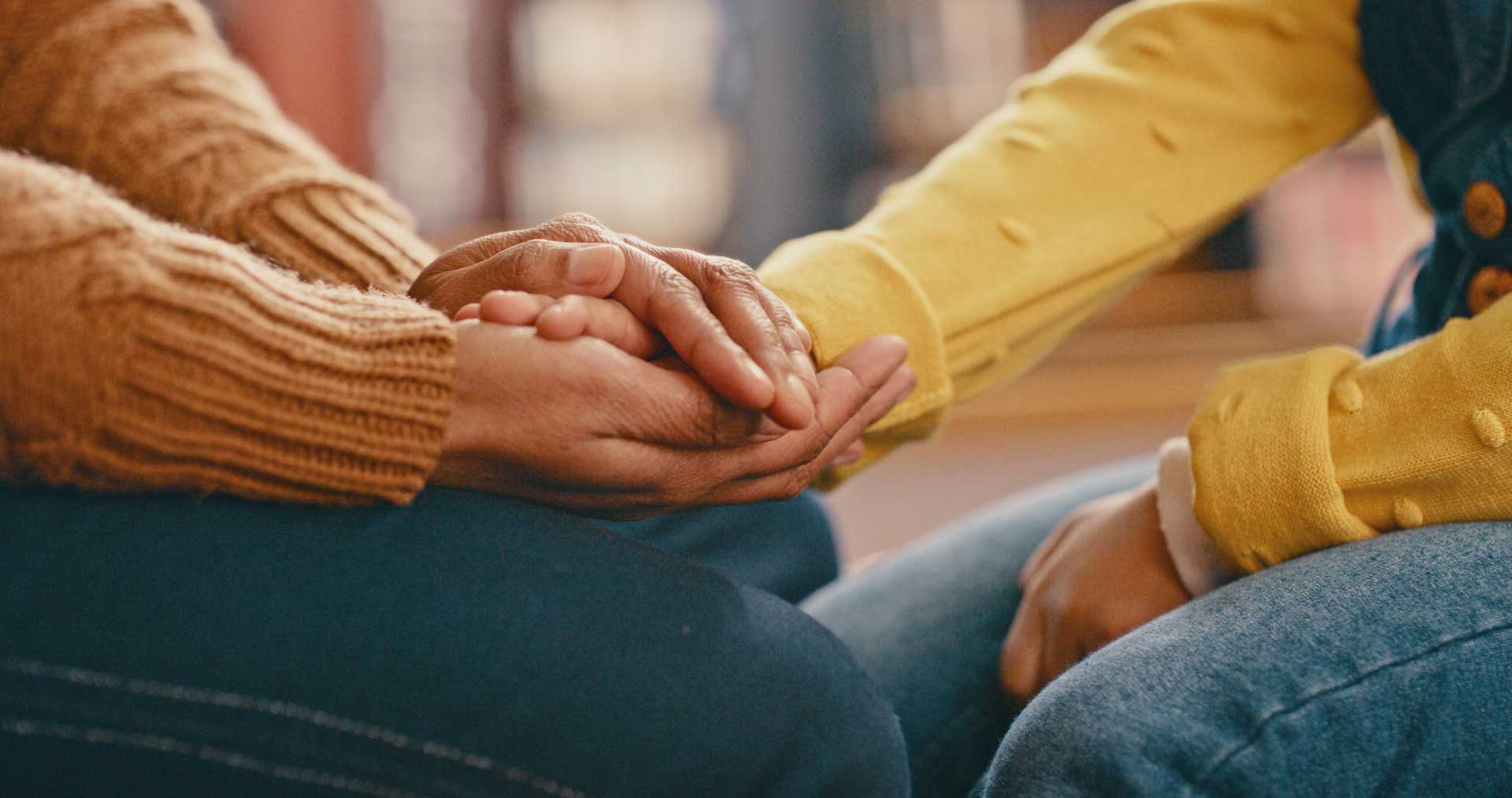  People holding hands to represent care, love and support for one and another.