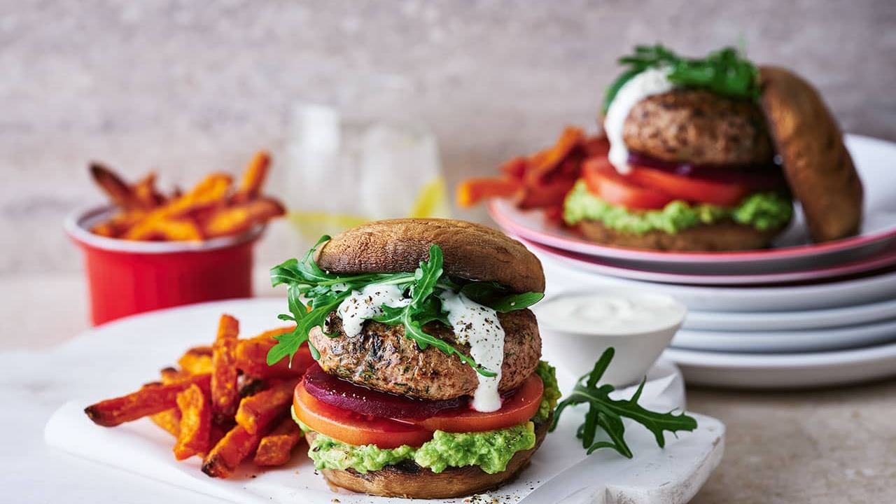 Turkey mushroom burger with a side serving of chips and dipping sauce