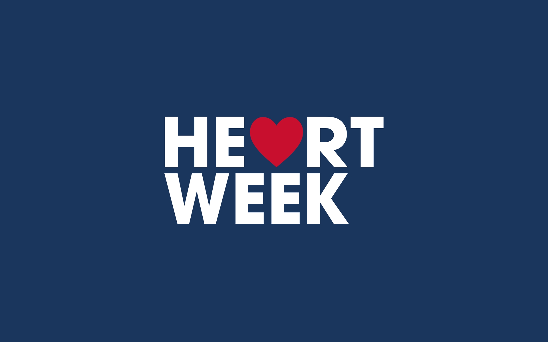 Logo: Heart Week, white text with red heart on dark blue background