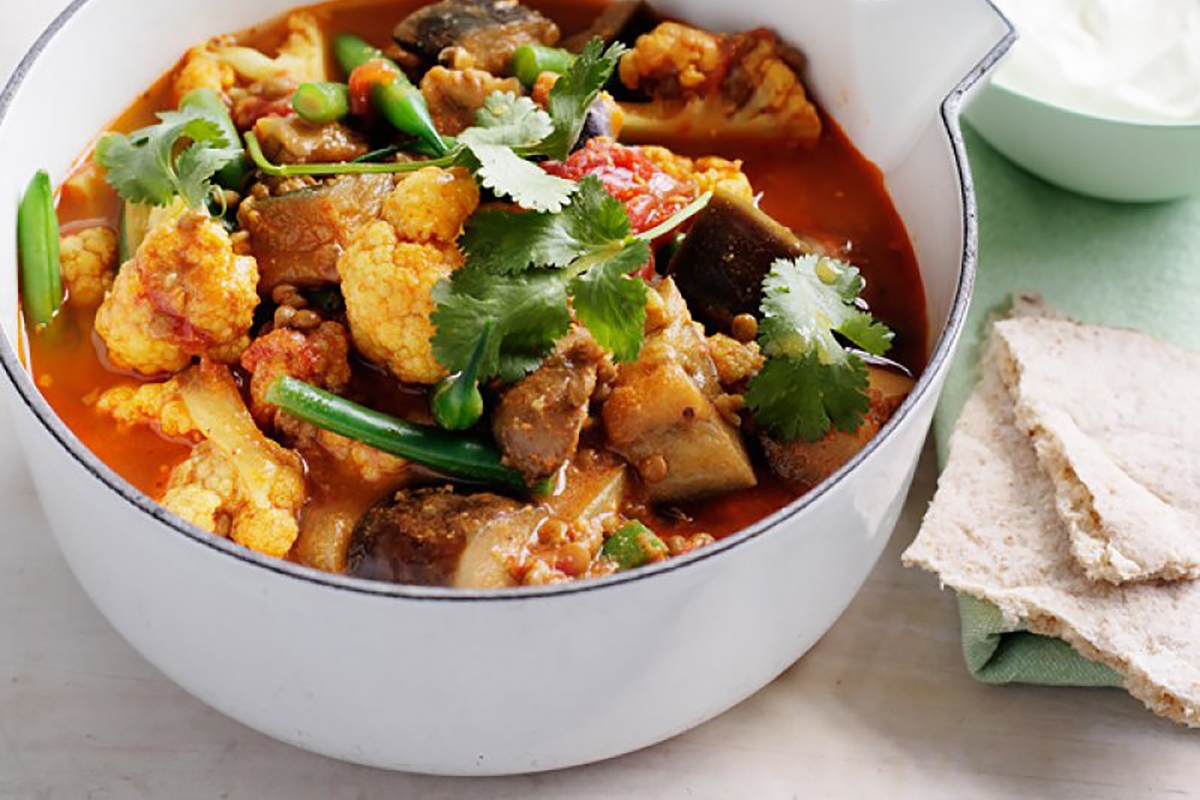 A savory bowl of curry filled with colorful vegetables
