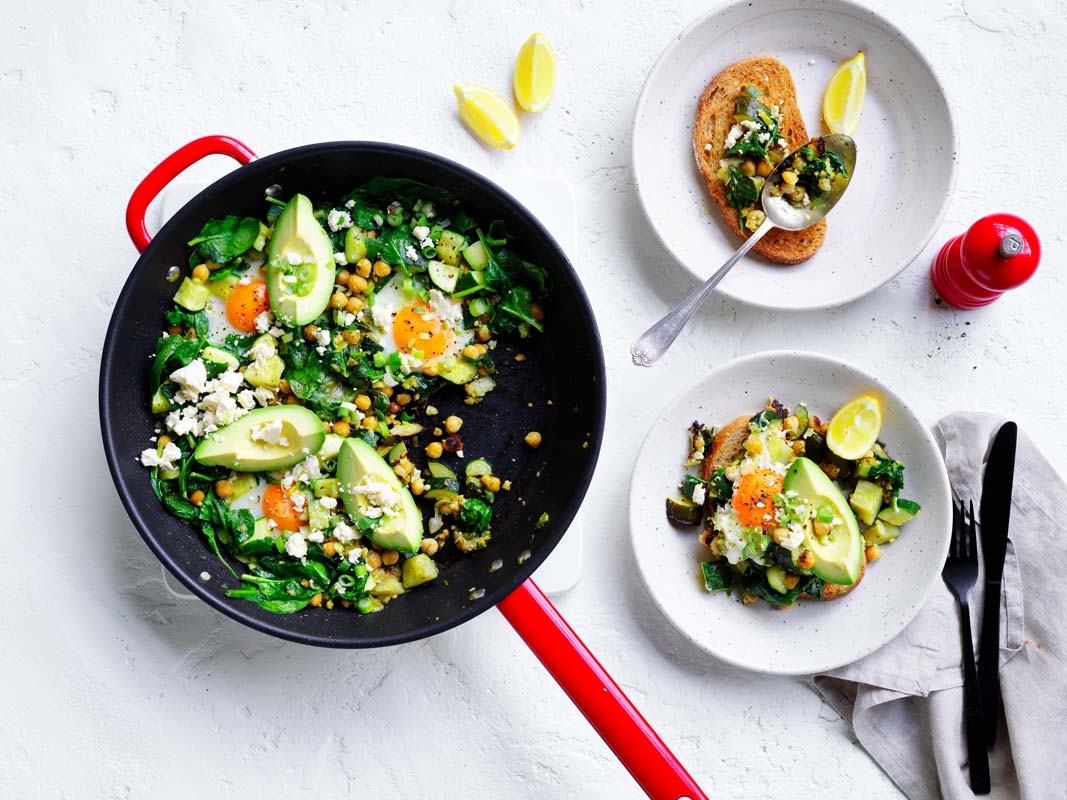 Green shakshuka serves in a table setting 