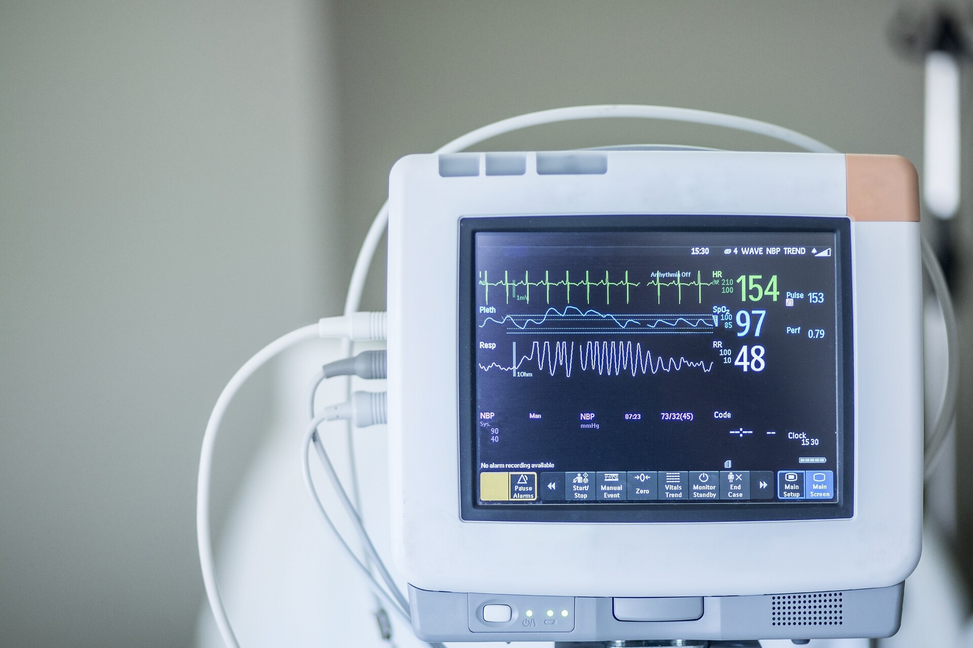 A medical monitor displays vital signs