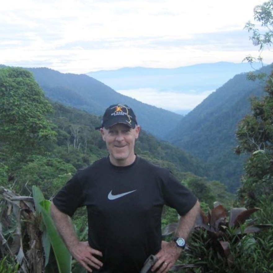 Tony standing on a mountain on the Kokoda Track
