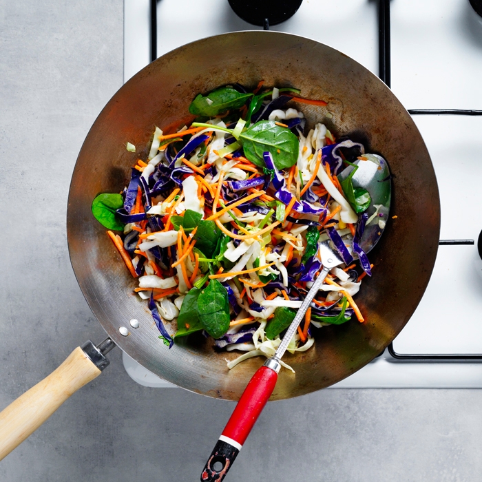 Vegetable mix and garlic frying in a wok
