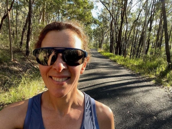 Dr Jessica Orchard taking a selfie on a country roar with sunglasses on