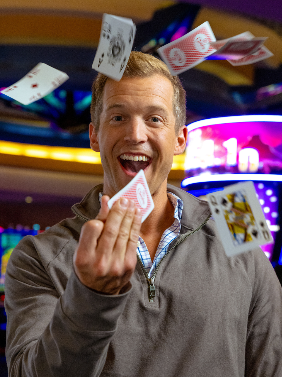 Guy throwing a deck of cards into the air