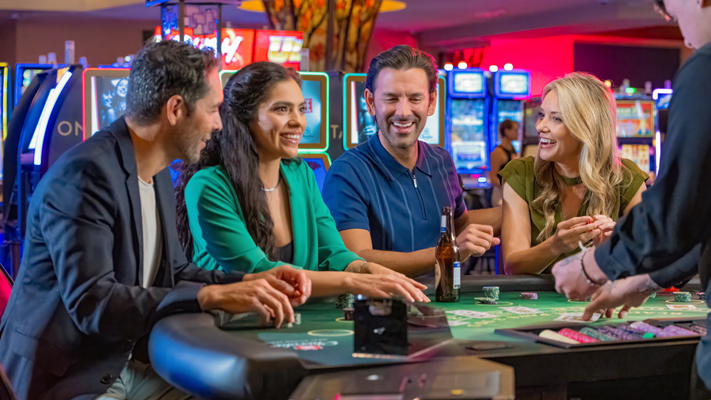 Smiling group of people playing blackjack