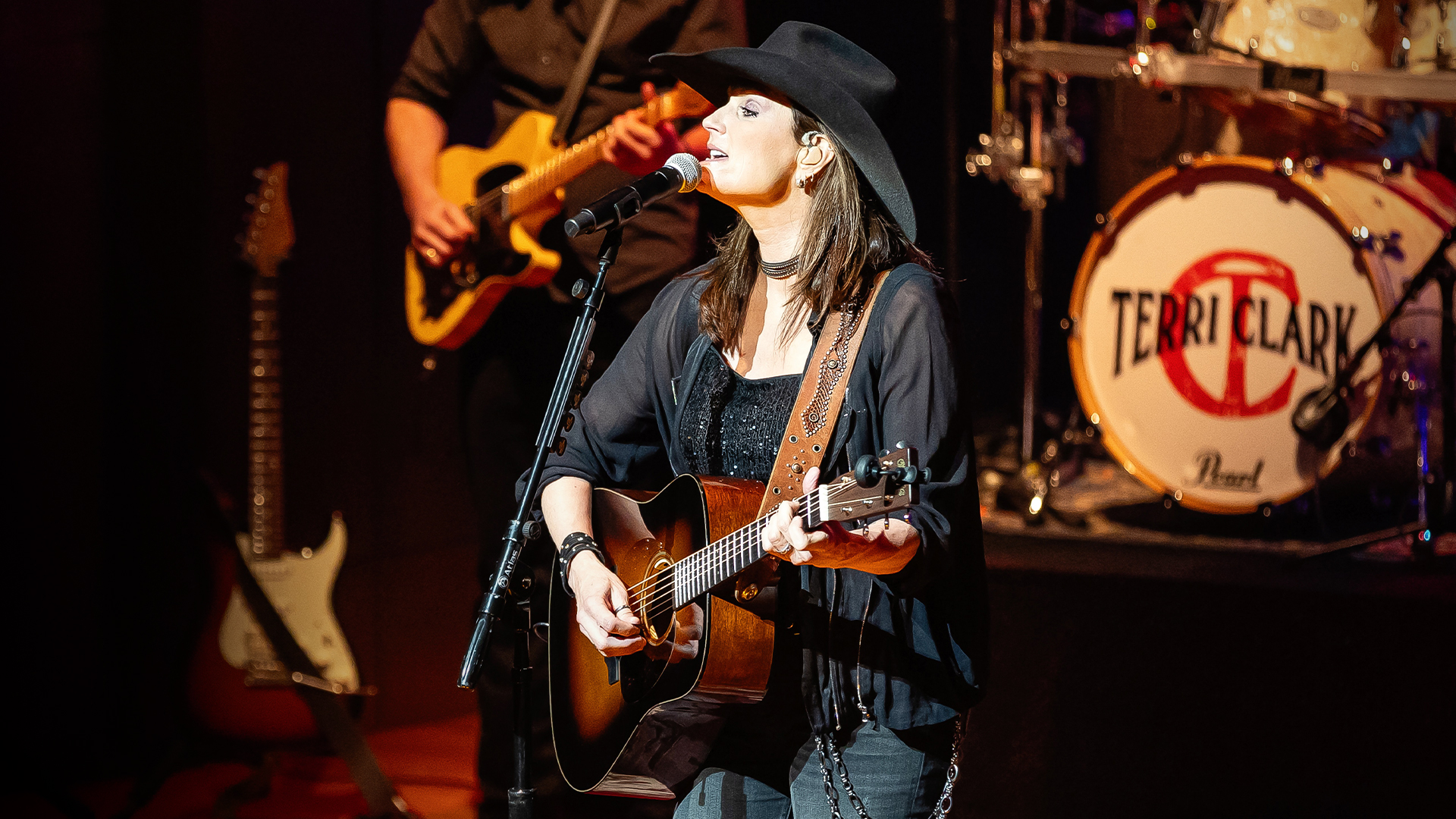 Image of Terri Clark melting faces with a guitar