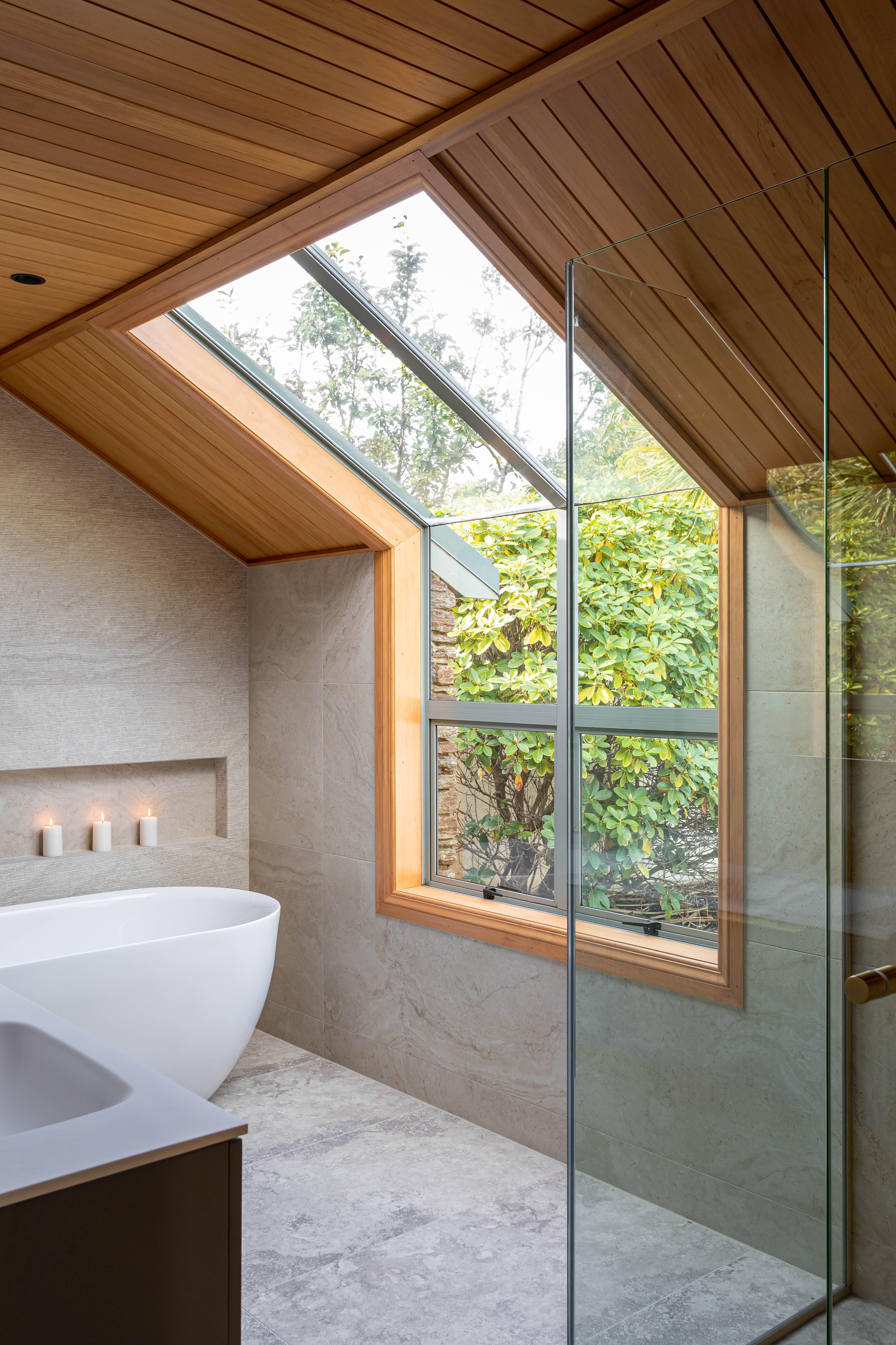 Carmen Hubber designed bathroom of Hub Design. Slanted window.