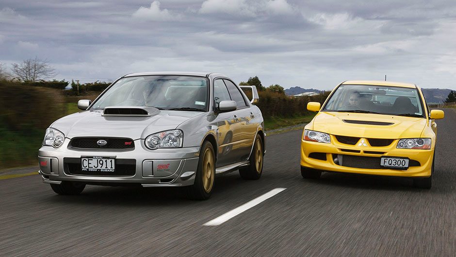 Mitsubishi Evo vs Subaru WRX STi front action