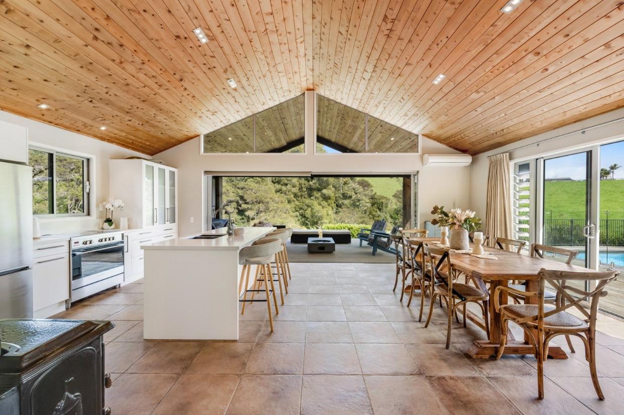 The barn-style home has wonderful rural views, and great indoor-outdoor flow.