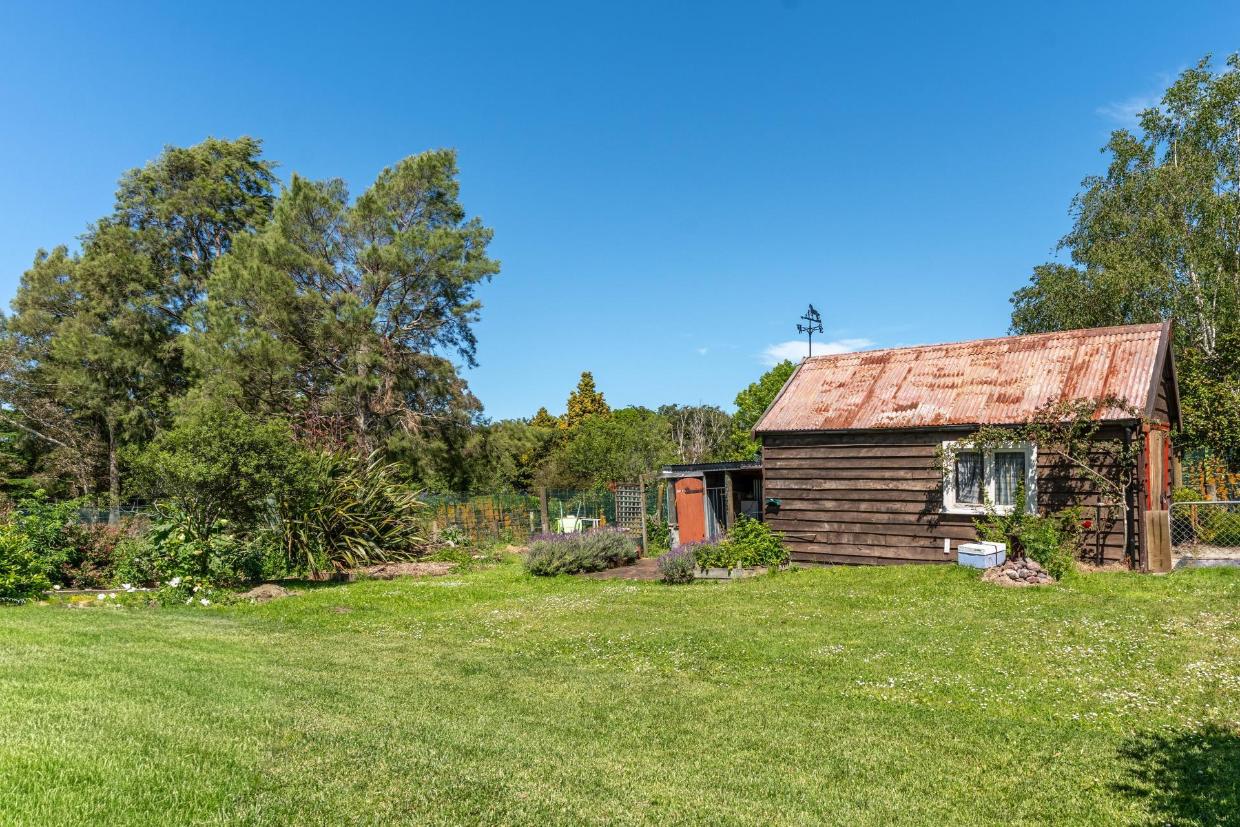 The old forge at the bottom of the garden has been restored and is now used as a workshop. 