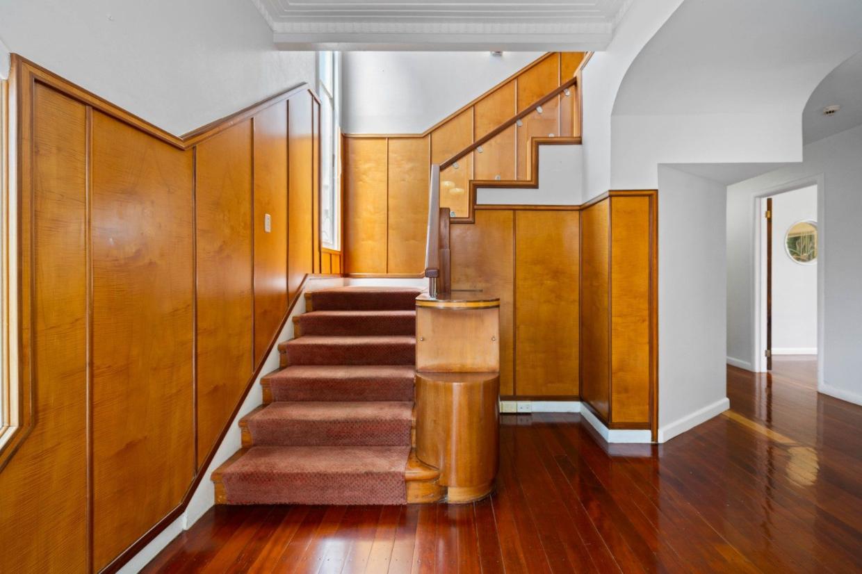 There is African sycamore paneling and original walnut veneer doors.