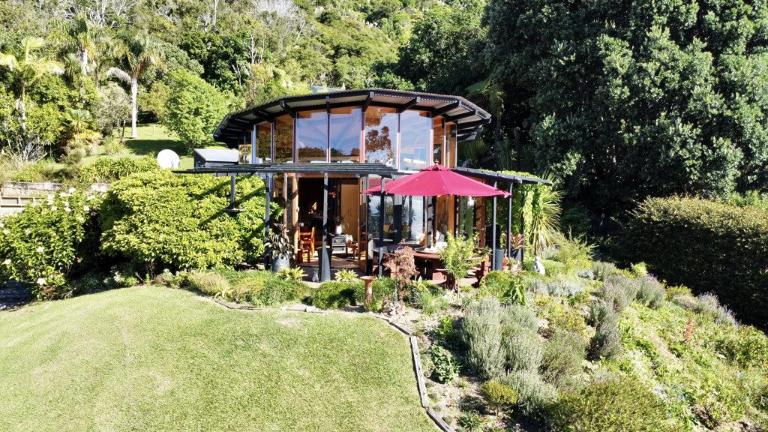 The unusual, architecturally designed Whanarua Bay home is on the market. Photo: RAY WHITE/TRADE ME