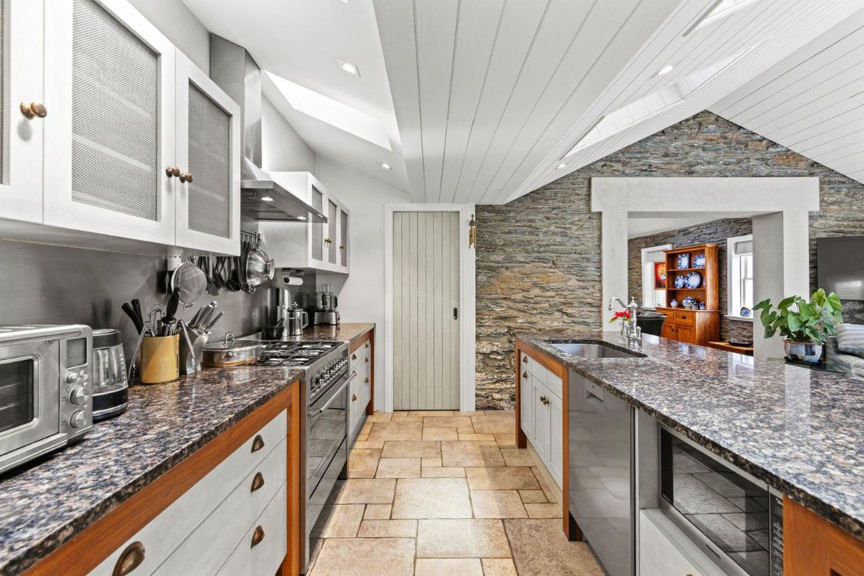 The kitchen features tiling and marble.