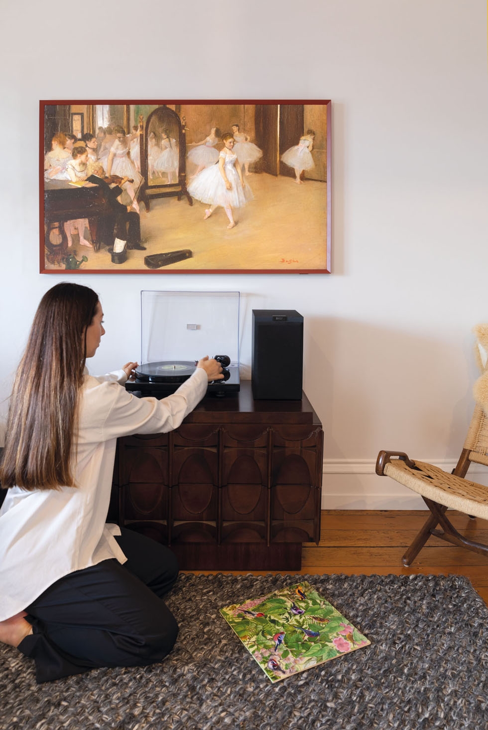 Sarah Lindsay places a record on her record player